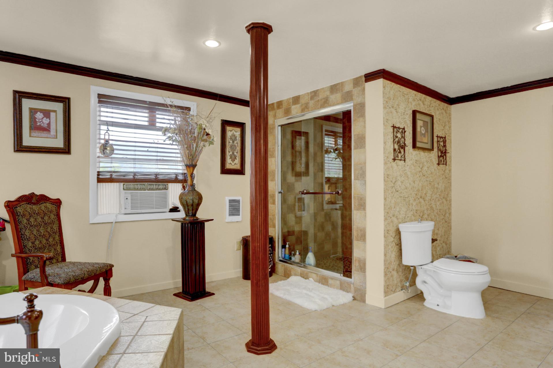 1742 Mineral Spring Road Reading, PA 19602 - Photo 16 of 31 a bathroom with a toilet and a shower