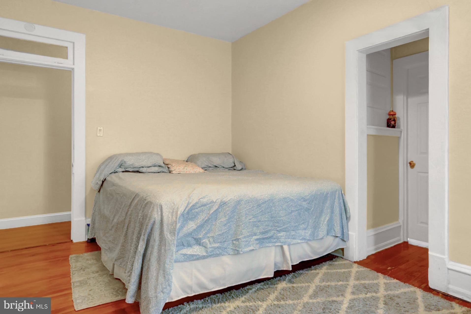 1742 Mineral Spring Road Reading, PA 19602 - Photo 20 of 31 a bedroom with a bed and wooden floor