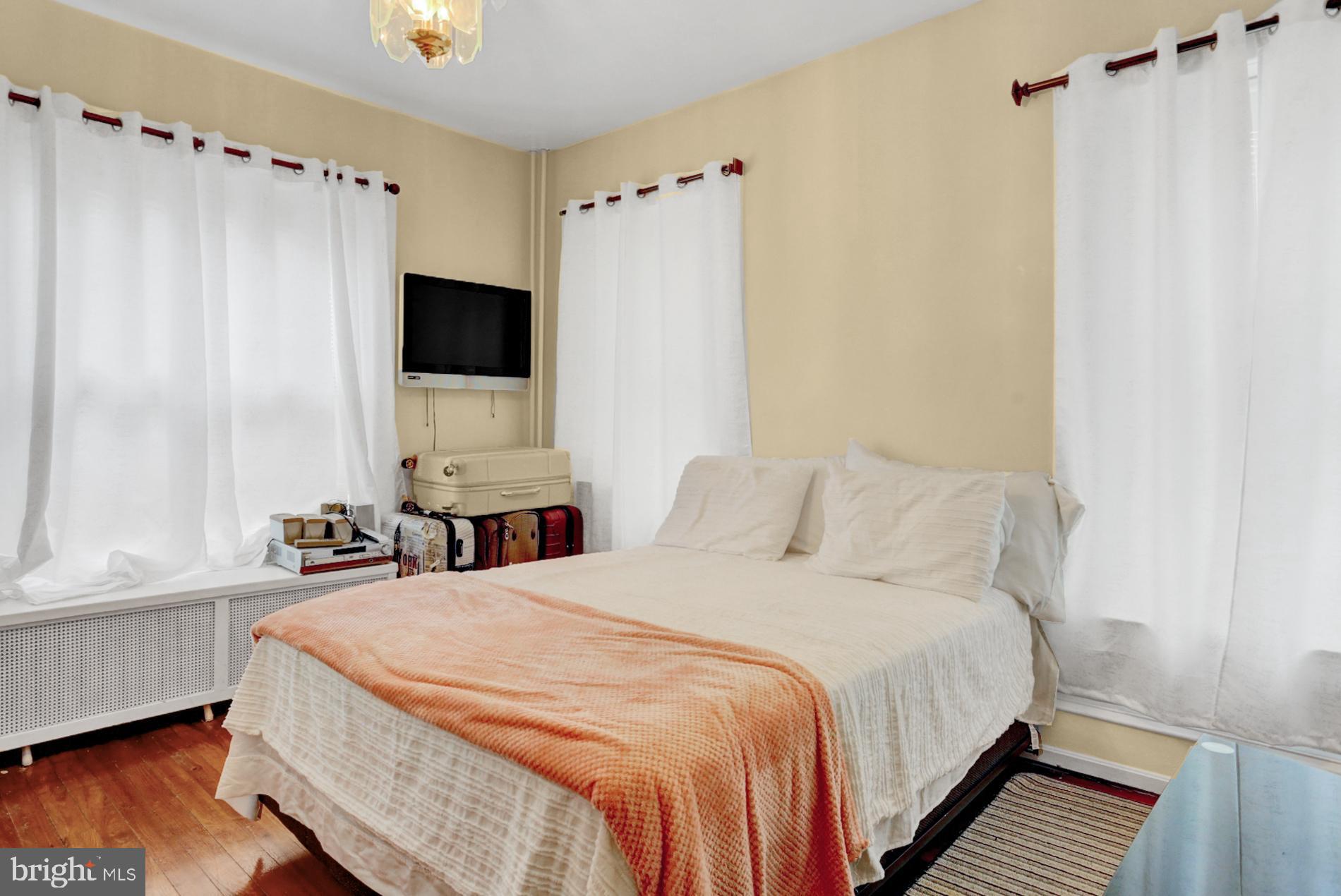 1742 Mineral Spring Road Reading, PA 19602 - Photo 22 of 31 a bedroom with a bed and a flat screen tv