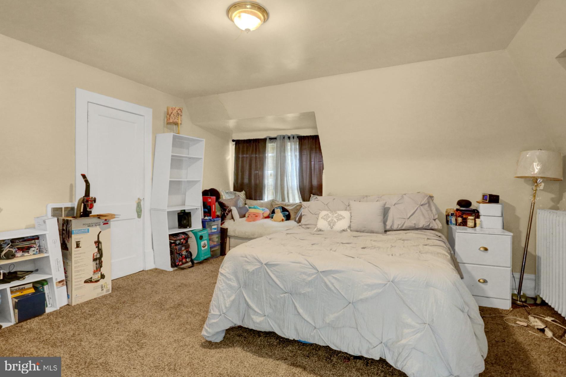 1742 Mineral Spring Road Reading, PA 19602 - Photo 24 of 31 a bed room with a bed and a television