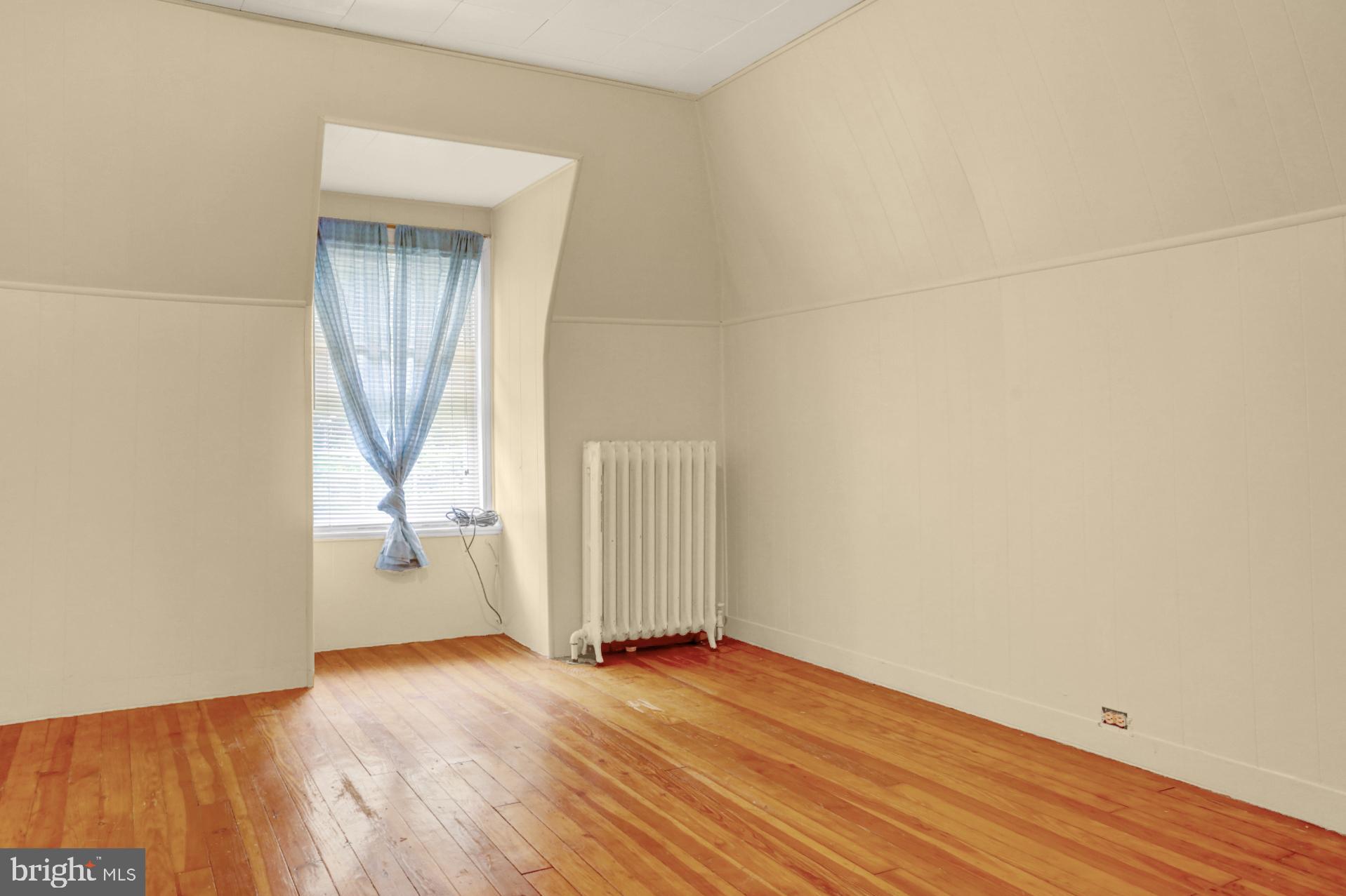 1742 Mineral Spring Road Reading, PA 19602 - Photo 25 of 31 an empty room with wooden floor and a window