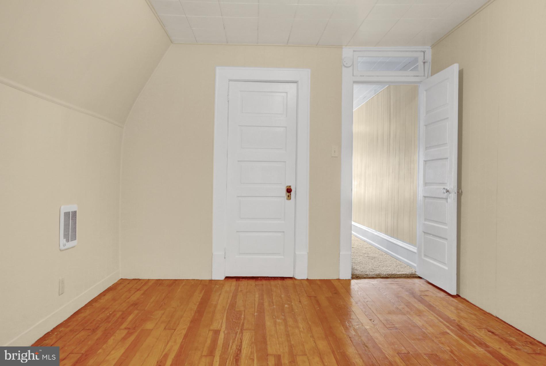 1742 Mineral Spring Road Reading, PA 19602 - Photo 26 of 31 an empty room with wooden floor and closet