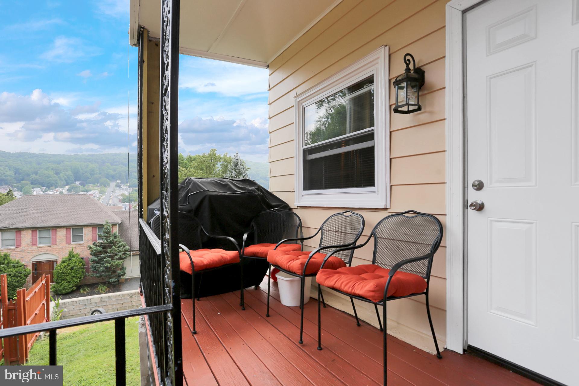 1742 Mineral Spring Road Reading, PA 19602 - Photo 29 of 31 a backyard of a house with table and chairs