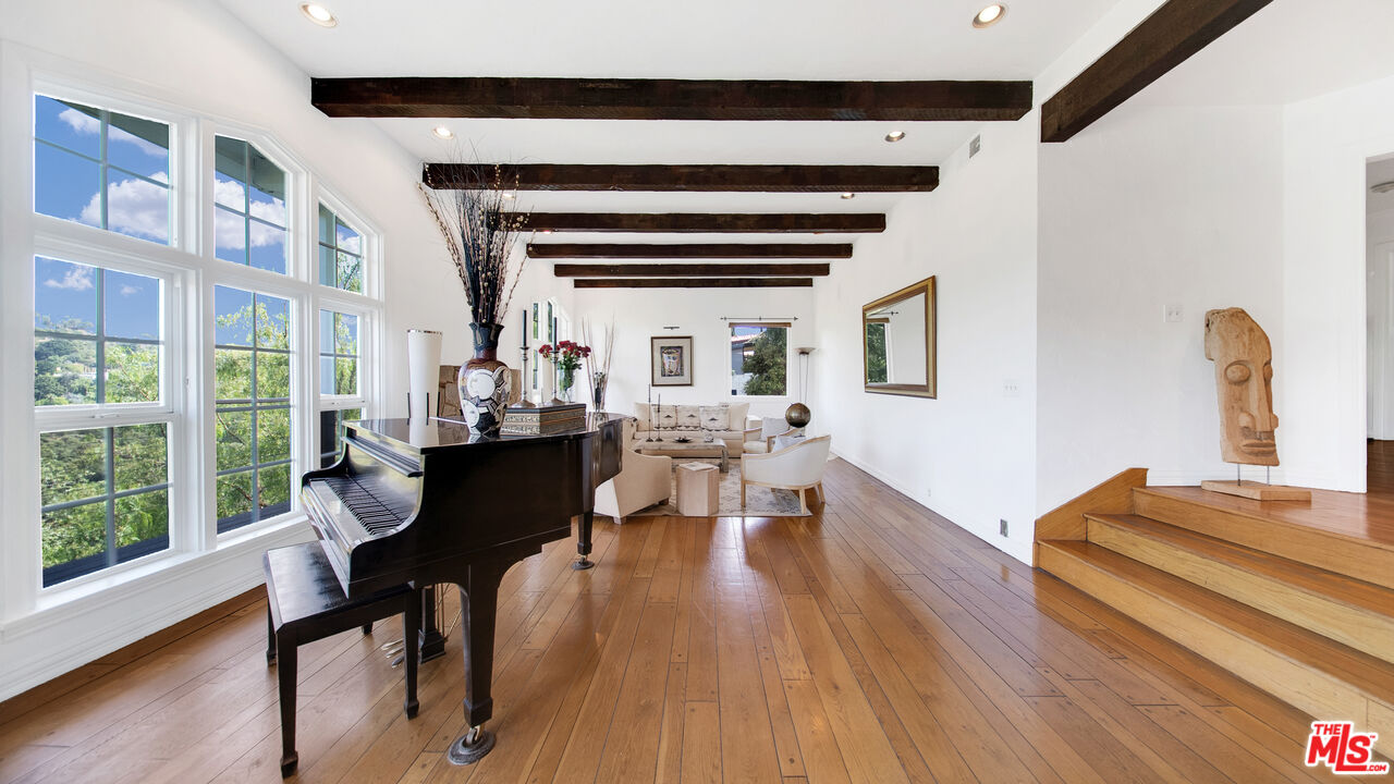 2312 Kimridge Road Beverly Hills, CA 90210 - Photo 24 of 60 a view of a dining room with furniture and wooden floor