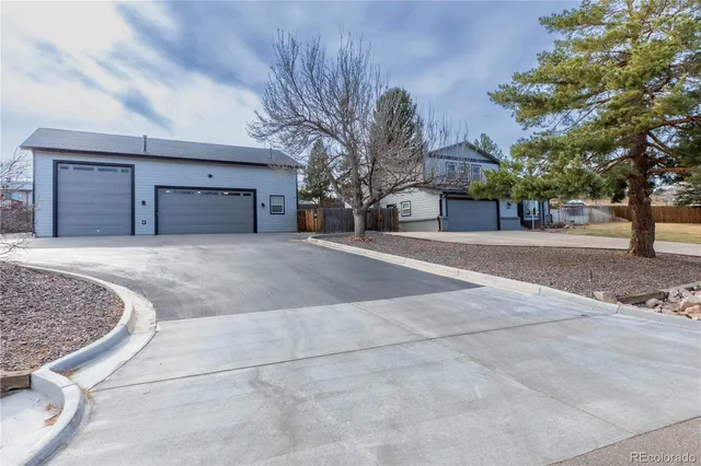 a view of a house with a snow in the yard