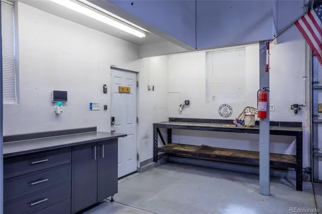a room with wooden furniture and window