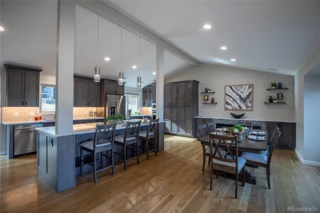 a view of a dining area with furniture window and wooden floor