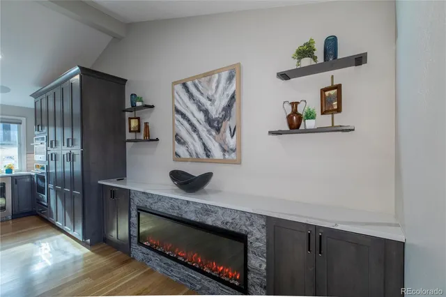 a kitchen with stainless steel appliances granite countertop a refrigerator and a stove