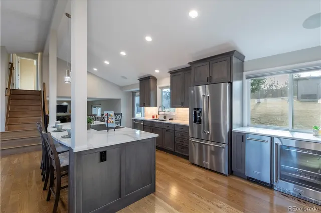 a kitchen with refrigerator cabinets and stainless steel appliances