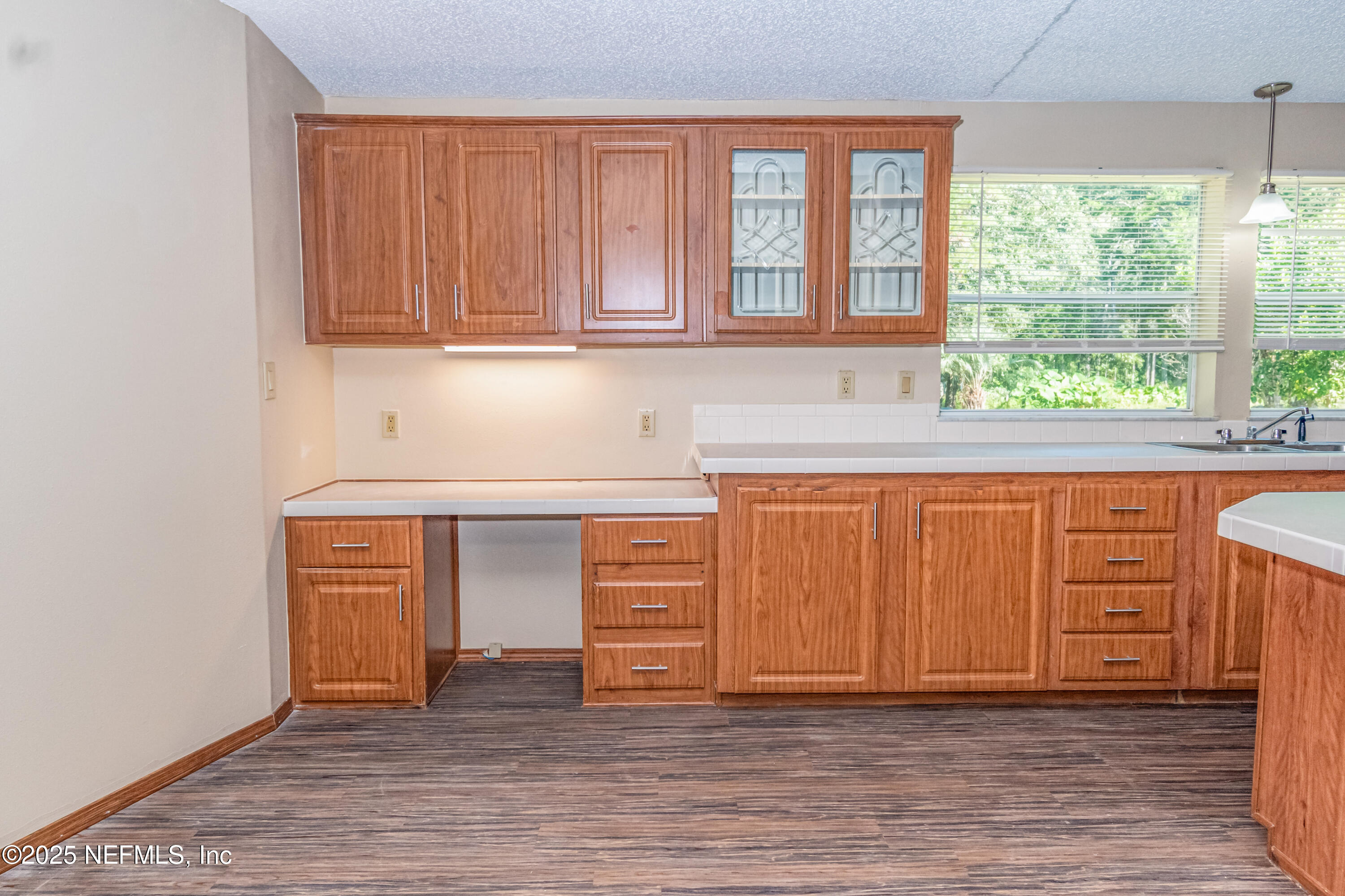 5577 Myrtle Road Macclenny, FL 32063 - Photo 14 of 58 an empty room with wooden floor and windows