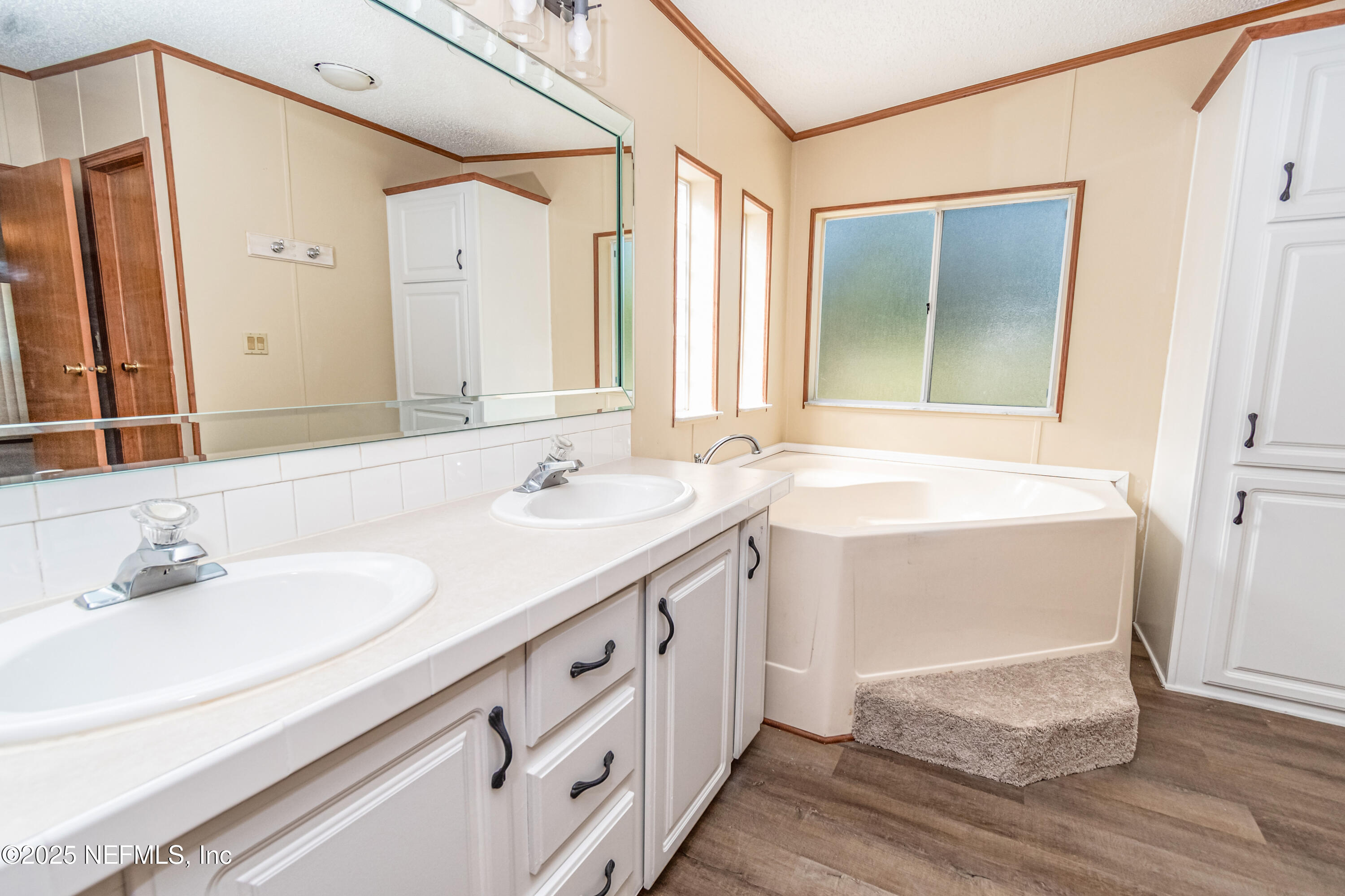 5577 Myrtle Road Macclenny, FL 32063 - Photo 24 of 58 a bathroom with a sink and a mirror