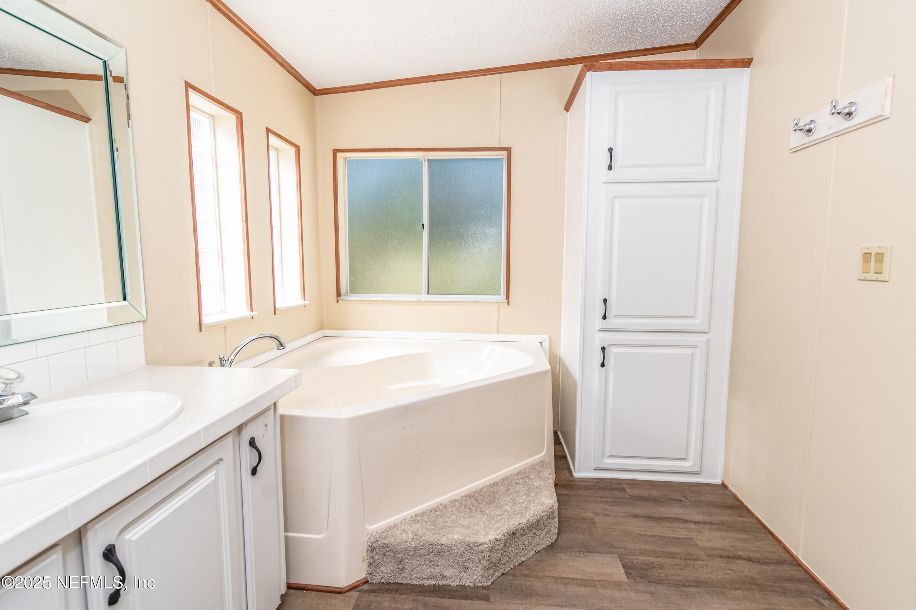 5577 Myrtle Road Macclenny, FL 32063 - Photo 26 of 58 a bathroom with a sink and a mirror