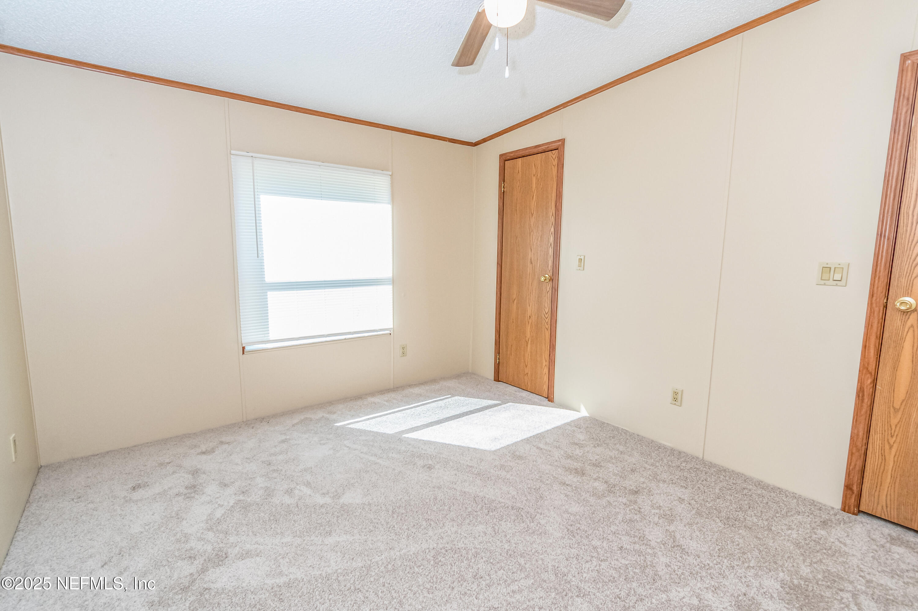 5577 Myrtle Road Macclenny, FL 32063 - Photo 29 of 58 an empty room with a window