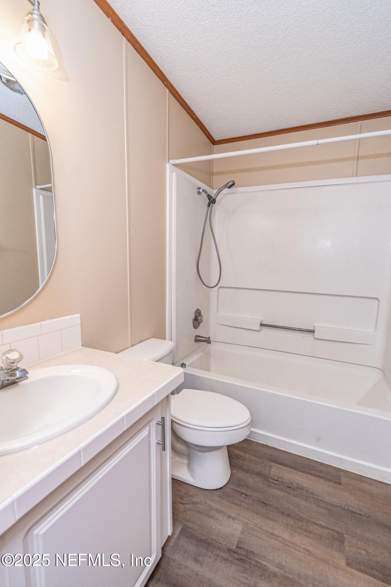 5577 Myrtle Road Macclenny, FL 32063 - Photo 30 of 58 a bathroom with a sink toilet a mirror and shower