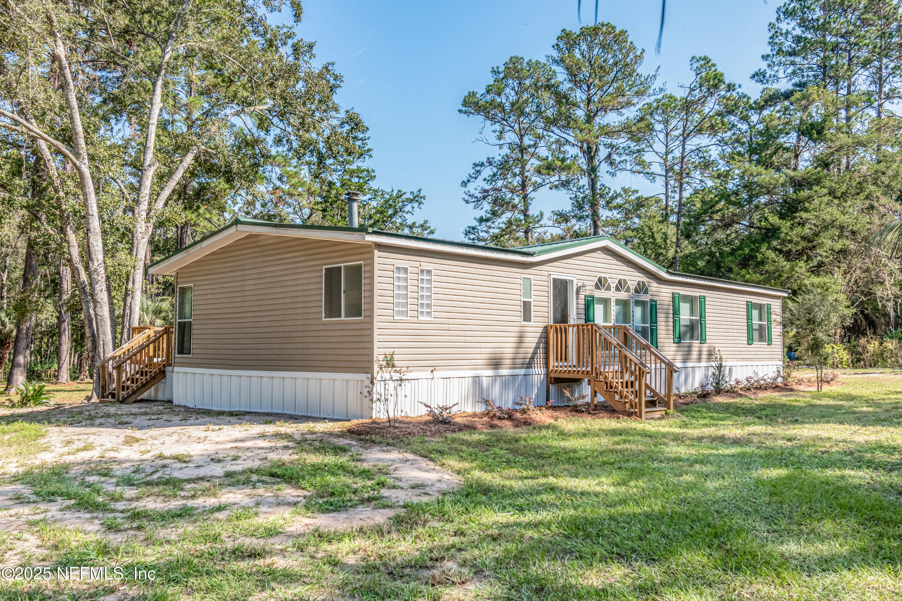 5577 Myrtle Road Macclenny, FL 32063 - Photo 3 of 58 a view of a house with a yard