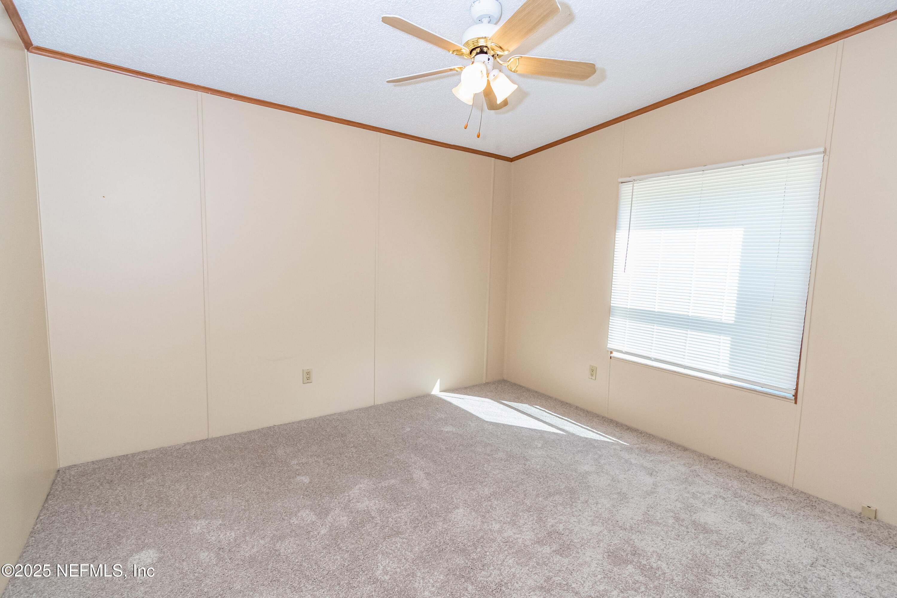 5577 Myrtle Road Macclenny, FL 32063 - Photo 31 of 58 an empty room with a window and a fan