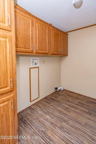 a view of a house with a yard and tree s