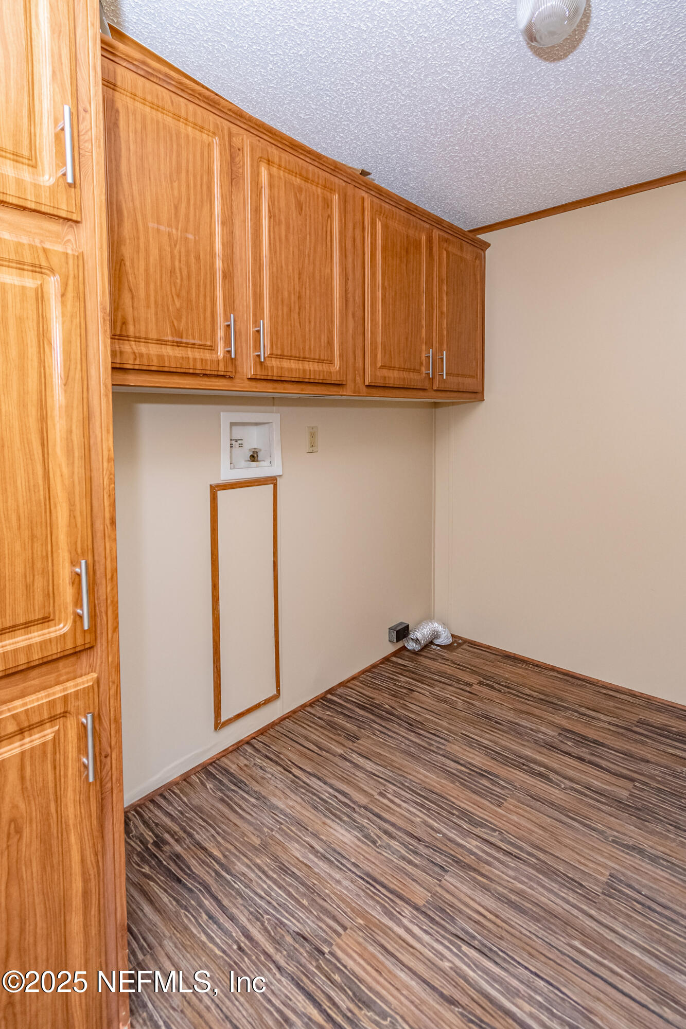 5577 Myrtle Road Macclenny, FL 32063 - Photo 38 of 58 a view of a room with wooden floor and cabinet