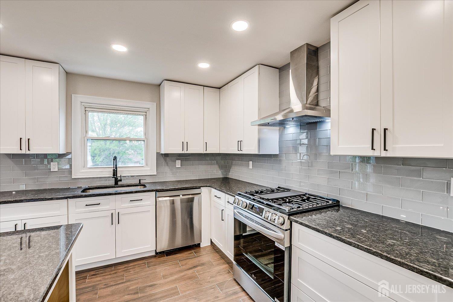 3 Birch Road Edison, NJ 08817 - Photo 14 of 33 a kitchen with stainless steel appliances granite countertop a sink a stove and cabinets