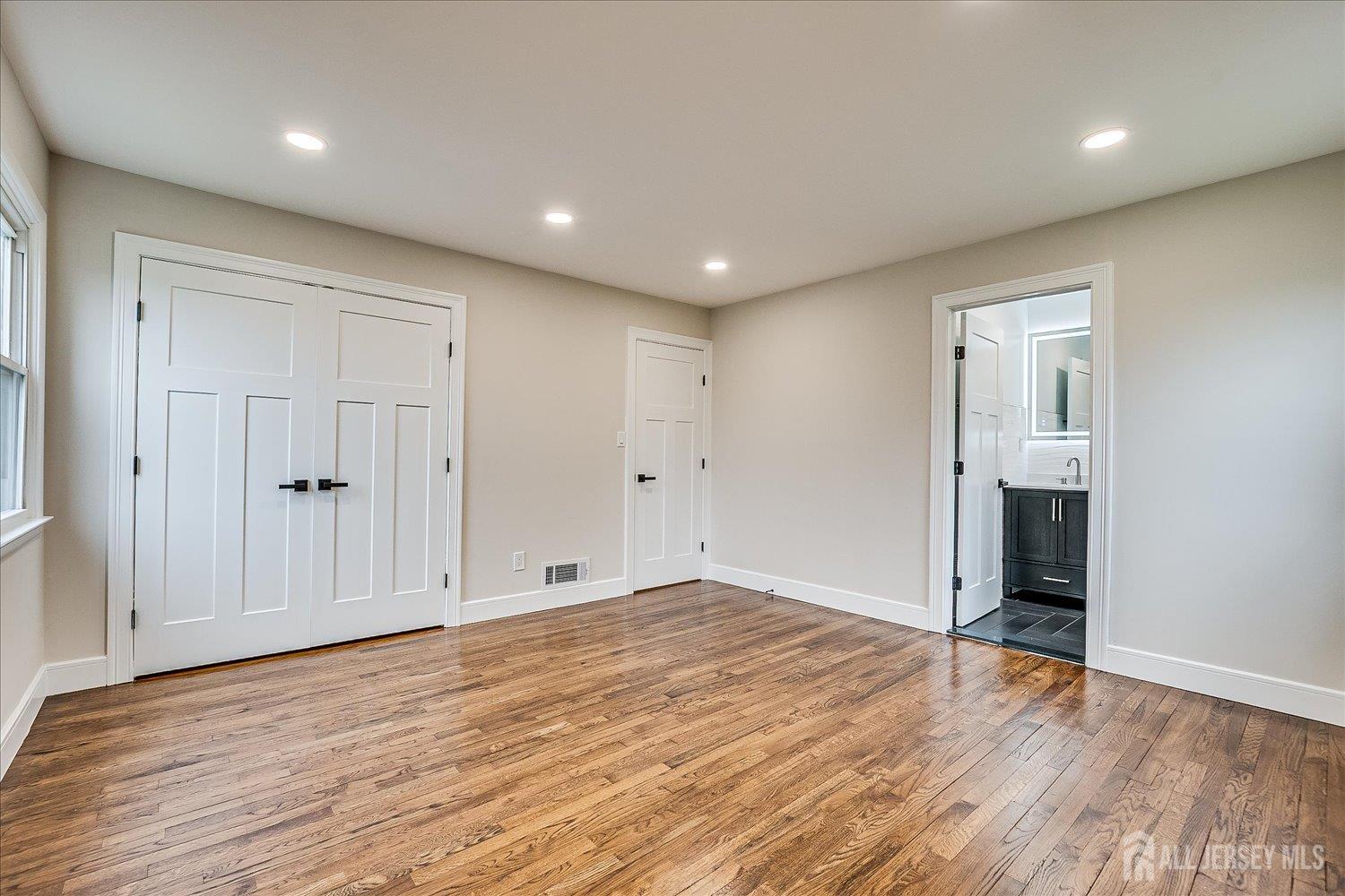 3 Birch Road Edison, NJ 08817 - Photo 17 of 33 a view of an empty room with wooden floor