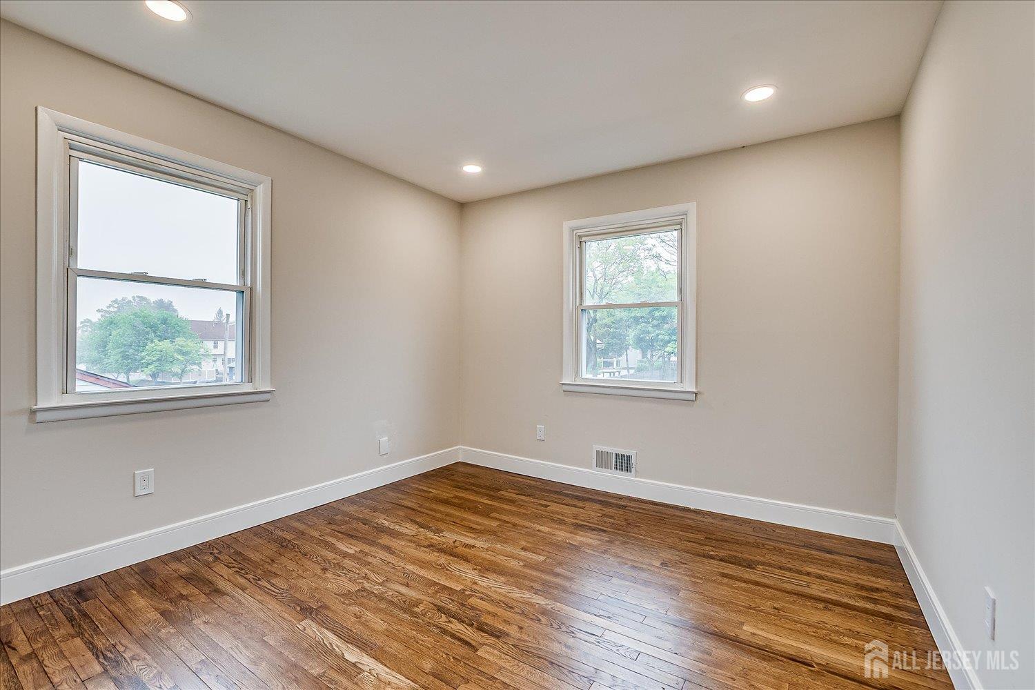 3 Birch Road Edison, NJ 08817 - Photo 19 of 33 a view of empty room with wooden floor and fan