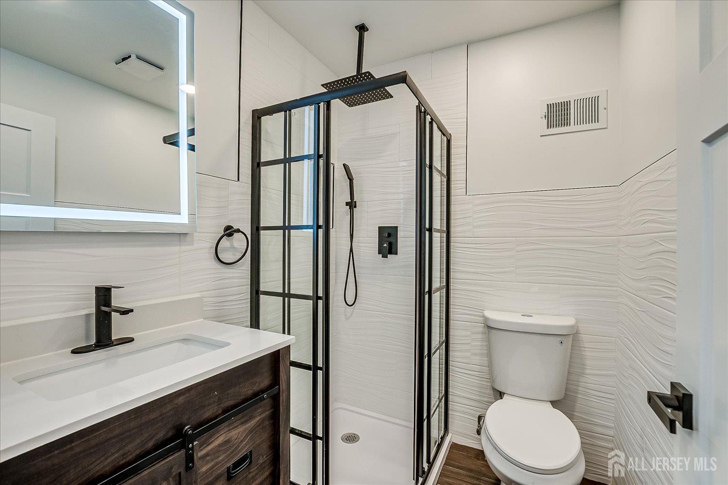 3 Birch Road Edison, NJ 08817 - Photo 23 of 33 a bathroom with a granite countertop sink toilet and shower