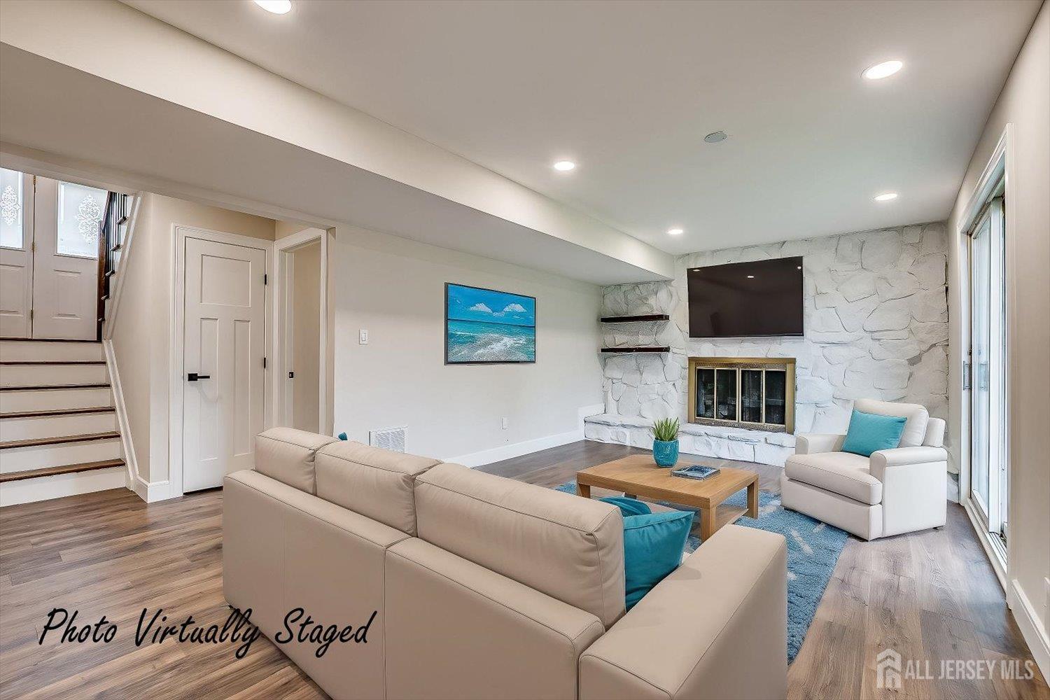 3 Birch Road Edison, NJ 08817 - Photo 25 of 33 a living room with furniture wooden floor and a fireplace