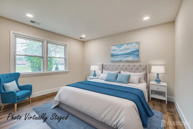 a bedroom with bed and a window