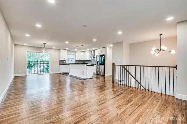a view of kitchen and kitchen with furniture wooden floor