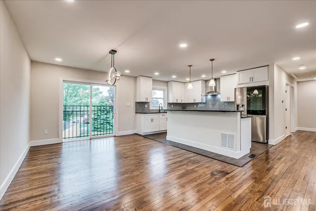 a view of kitchen with wooden floor