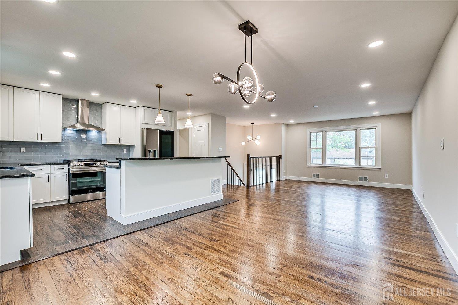 3 Birch Road Edison, NJ 08817 - Photo 9 of 33 a view of kitchen with sink and wooden floor