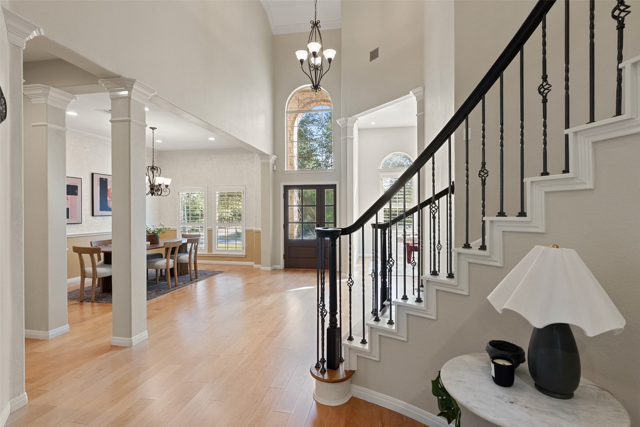 8215 Dark Ridge Cove Austin, TX 78737 - Photo 23 of 40 The grand two-story foyer featuring an elegant curved staircase leading to the second floor.