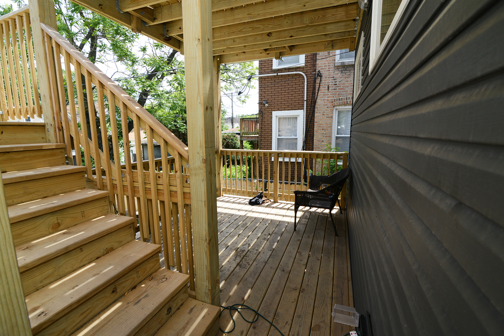 1051 North Springfield Avenue Chicago, IL 60651 - Photo 29 of 50 a view of balcony with wooden floor and outdoor seating