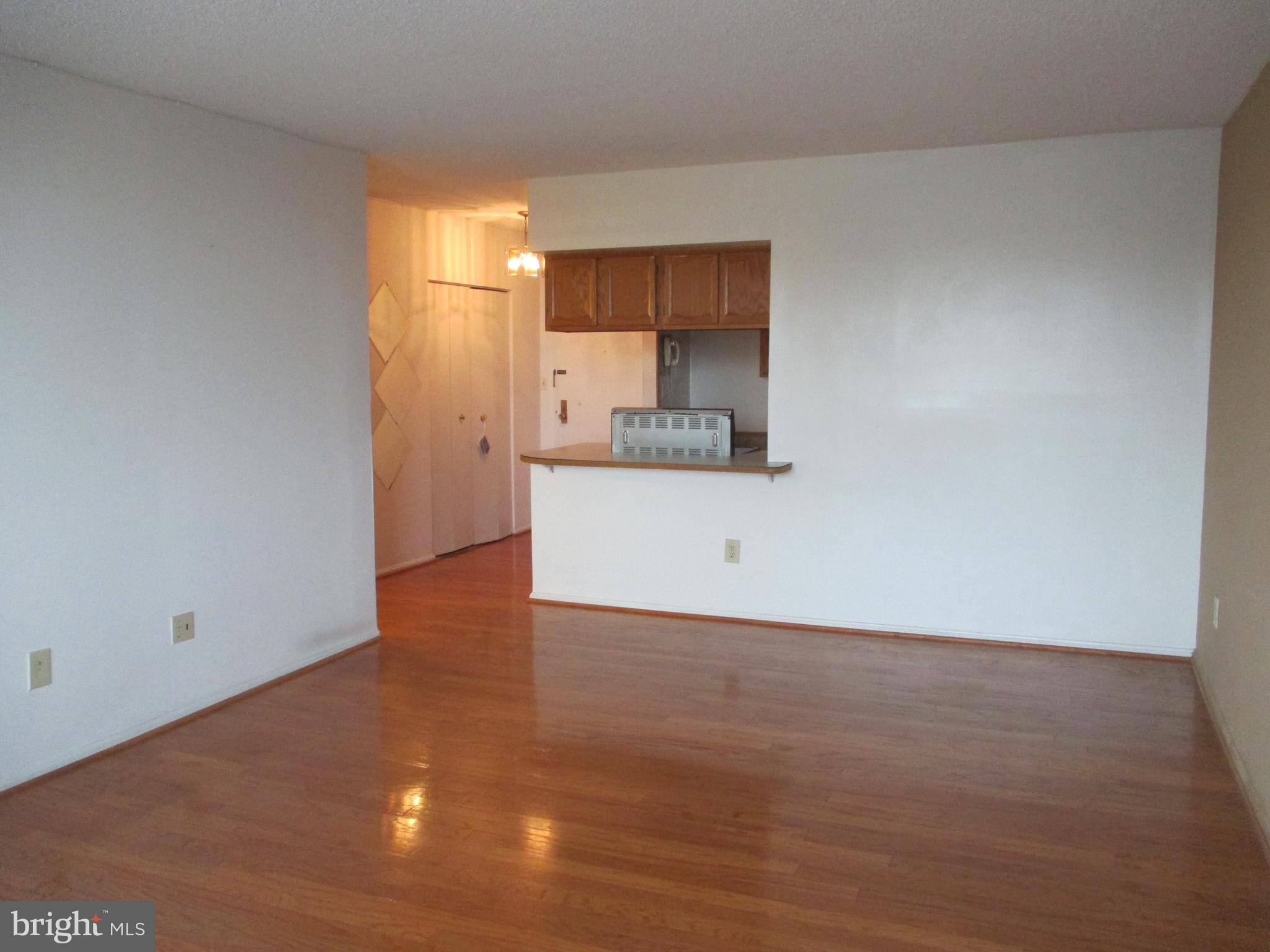 5500 Holmes Run Parkway, Unit 413 Alexandria, VA 22304 - Photo 5 of 8 a view of a kitchen with a sink and a window