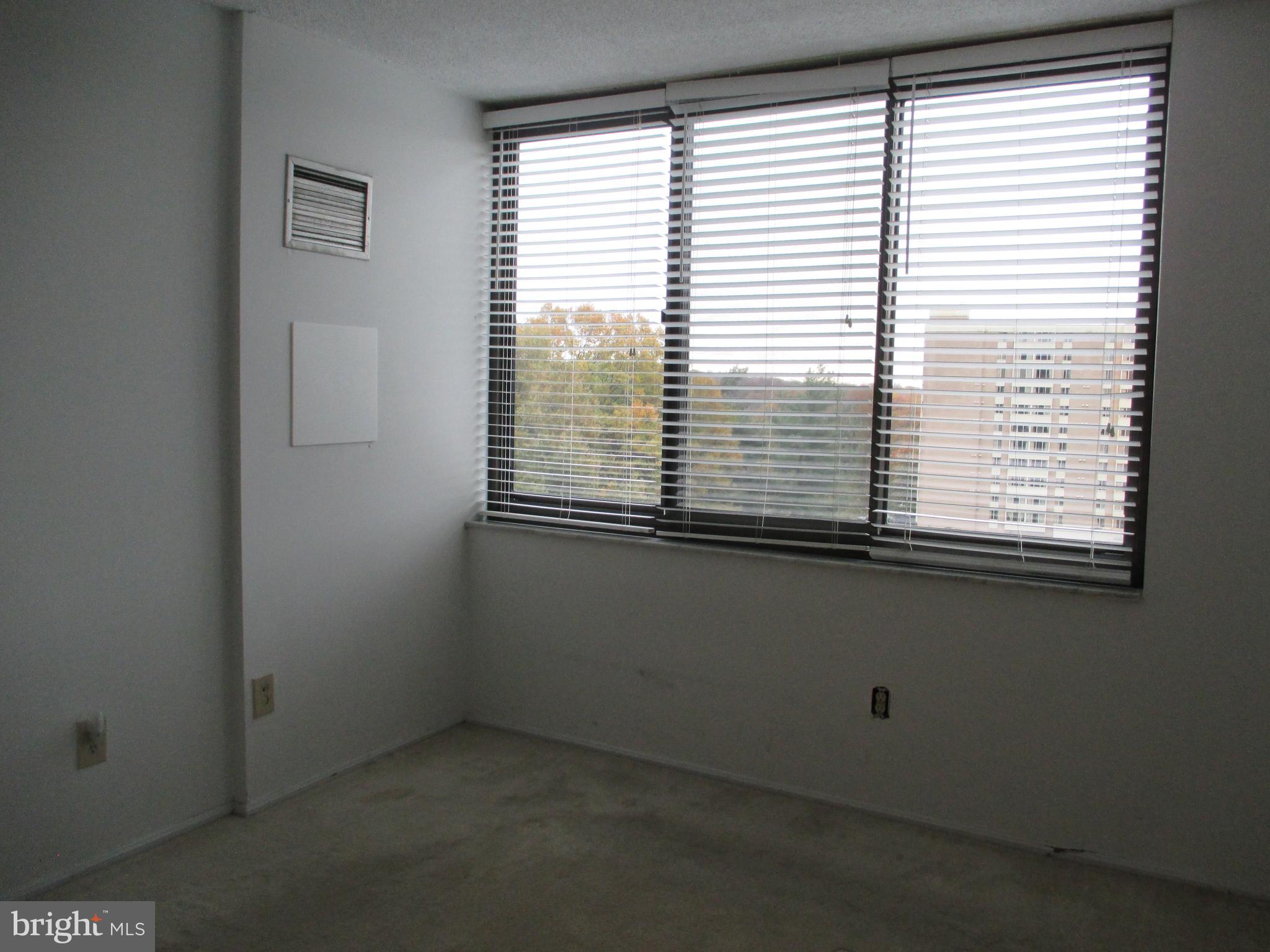 5500 Holmes Run Parkway, Unit 413 Alexandria, VA 22304 - Photo 7 of 8 a view of an empty room with a window