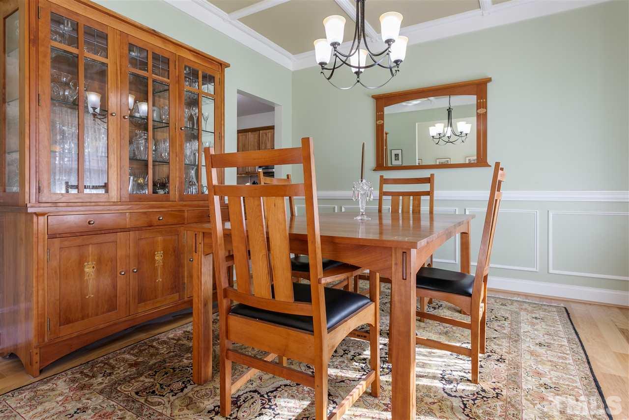 100 North Sunset Ridge Drive Willow Spring, NC 27592 - Photo 12 of 25 a view of a dining room with furniture and chandelier