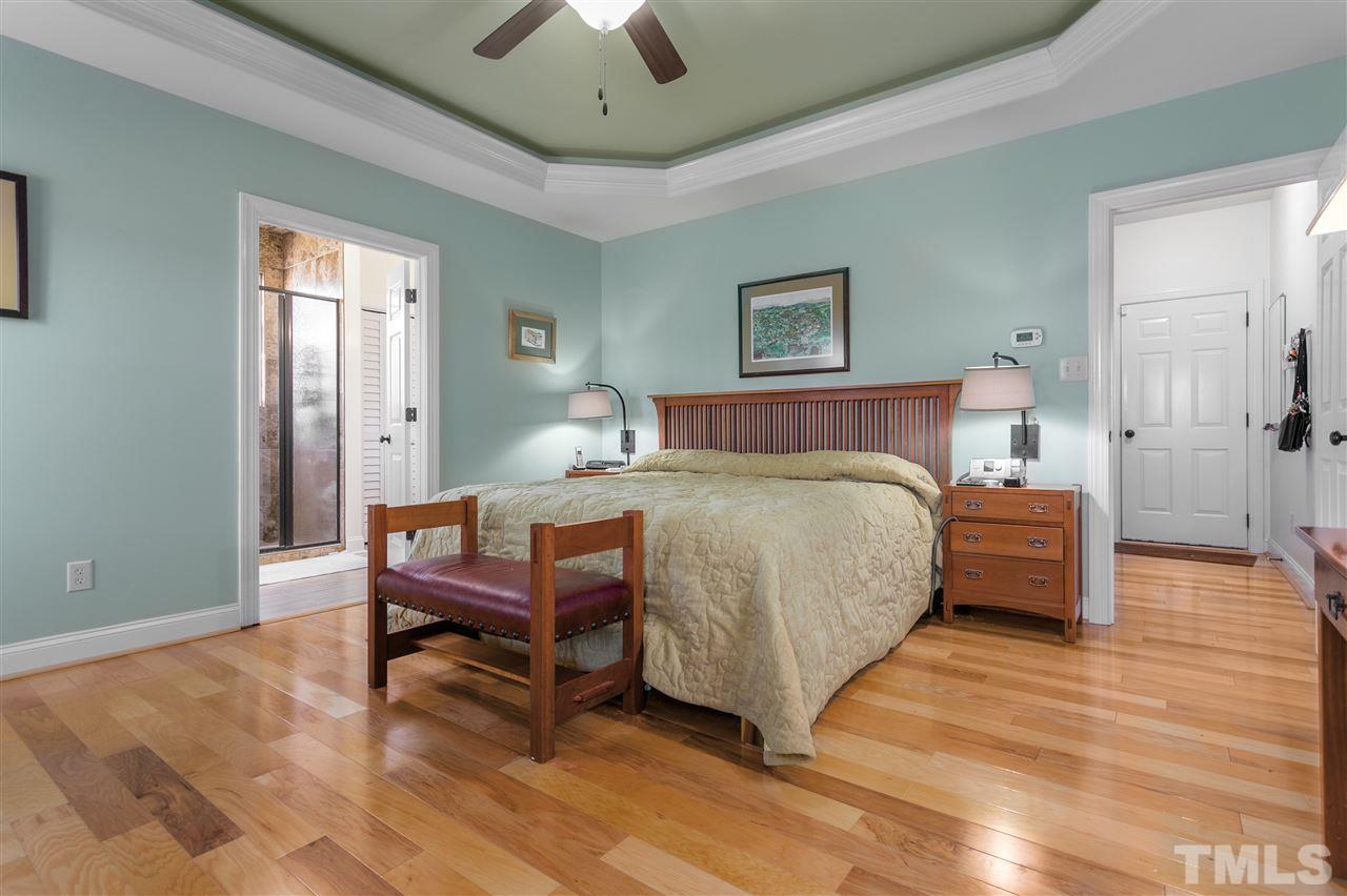 100 North Sunset Ridge Drive Willow Spring, NC 27592 - Photo 15 of 25 a bedroom with a bed and a table