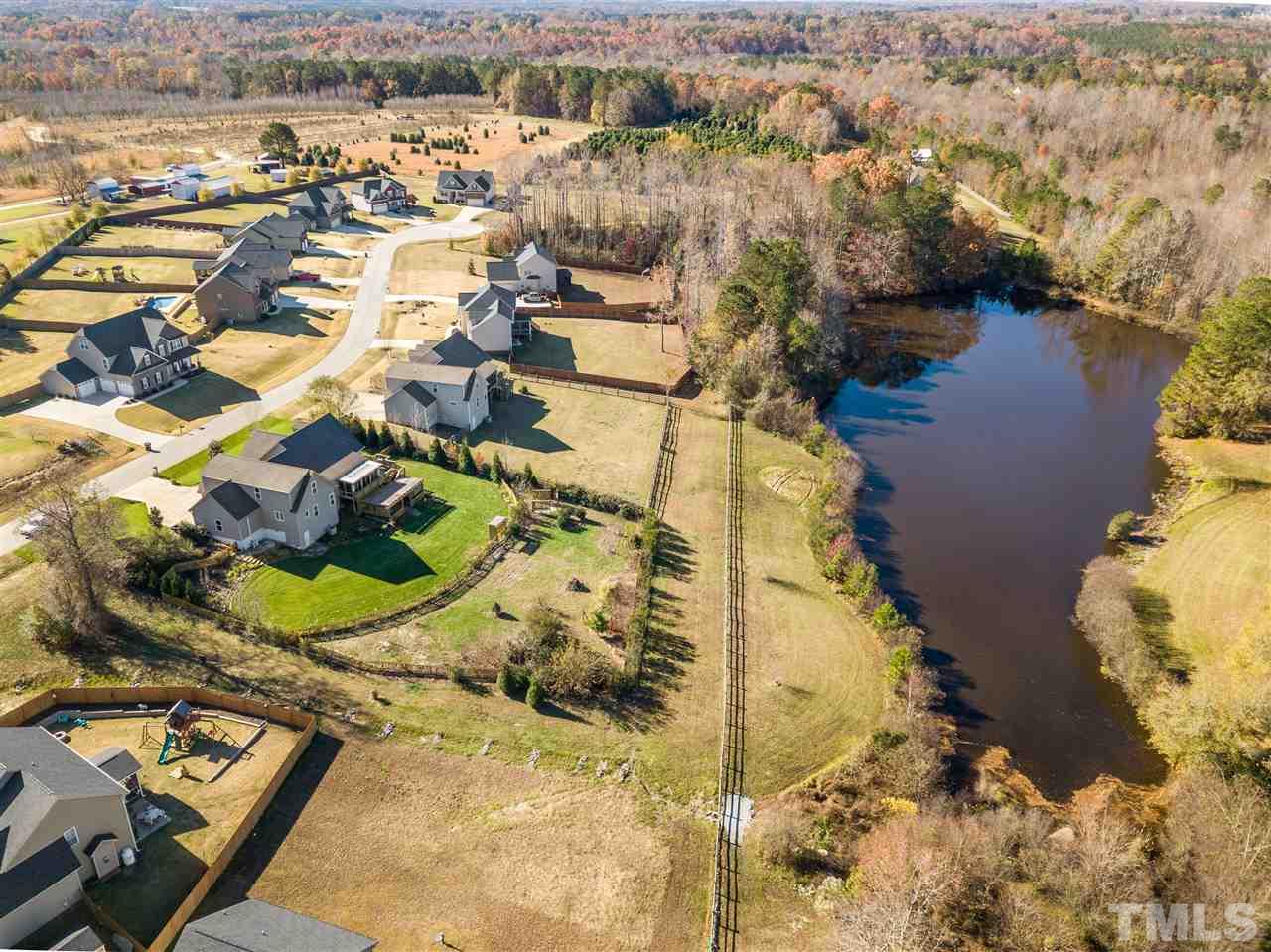 100 North Sunset Ridge Drive Willow Spring, NC 27592 - Photo 3 of 25 an aerial view of residential houses with outdoor space