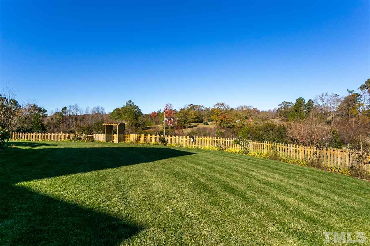 100 North Sunset Ridge Drive Willow Spring, NC 27592 - Photo 21 of 25 a view of a grassy field with trees