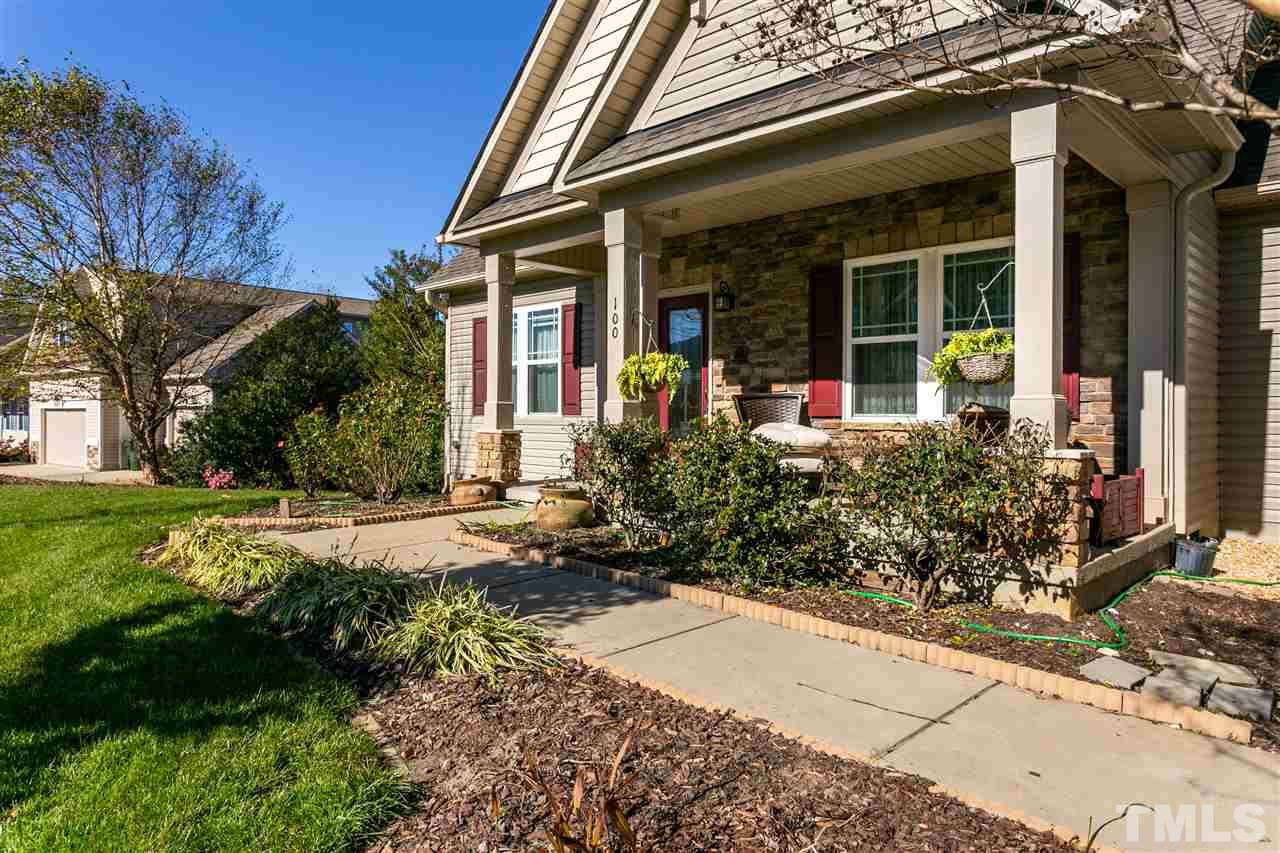 100 North Sunset Ridge Drive Willow Spring, NC 27592 - Photo 23 of 25 a front view of a house with garden