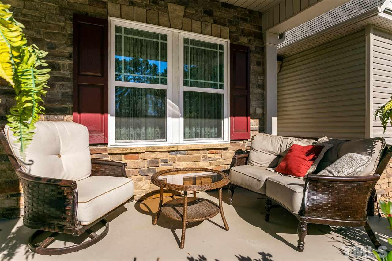 100 North Sunset Ridge Drive Willow Spring, NC 27592 - Photo 24 of 25 a balcony with furniture and a potted plant