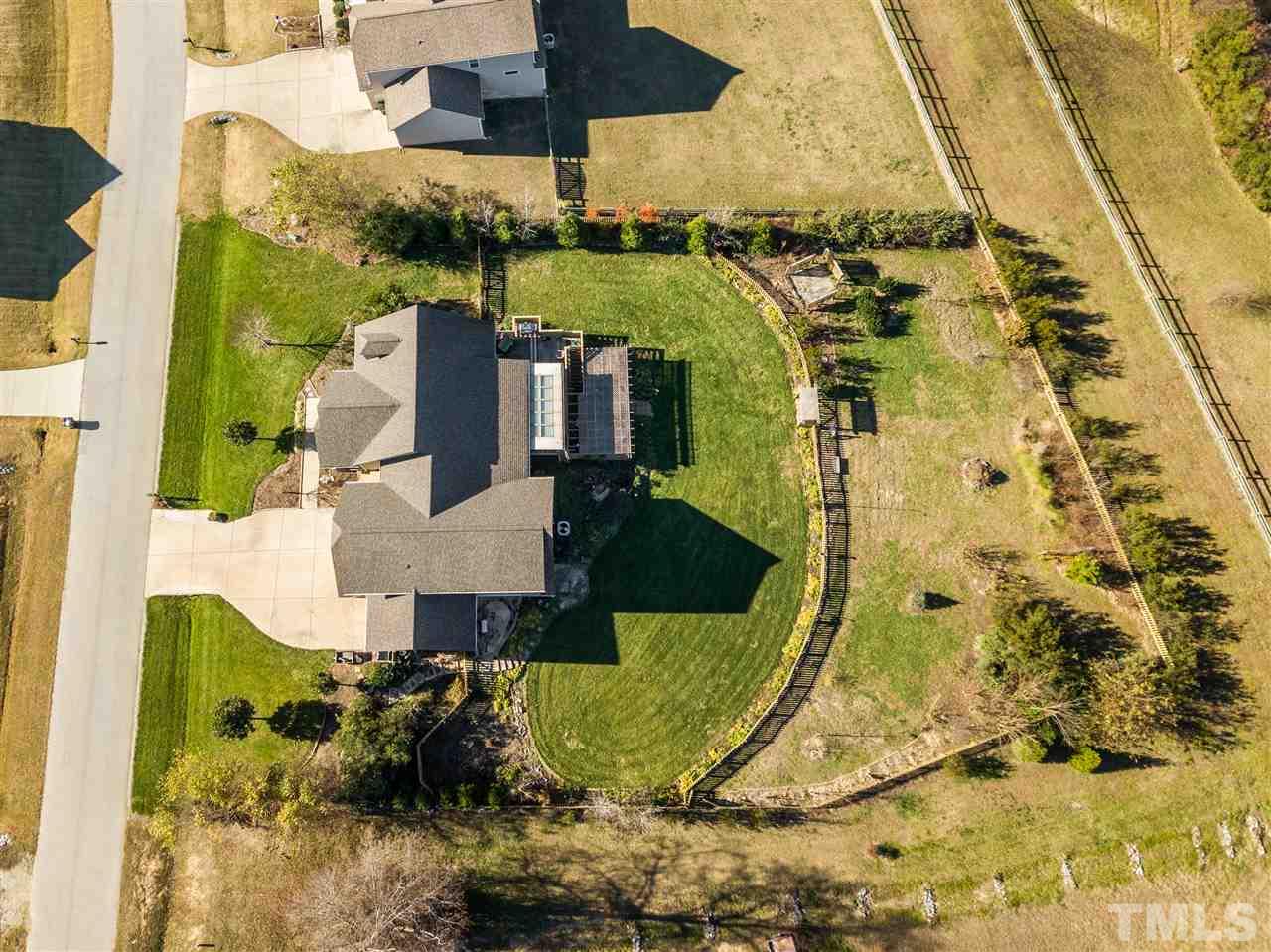 100 North Sunset Ridge Drive Willow Spring, NC 27592 - Photo 25 of 25 an aerial view of a house with a yard