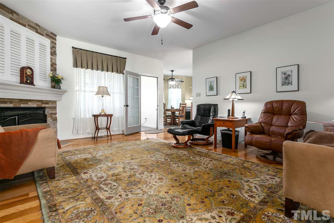 100 North Sunset Ridge Drive Willow Spring, NC 27592 - Photo 8 of 25 a living room with furniture and a fireplace