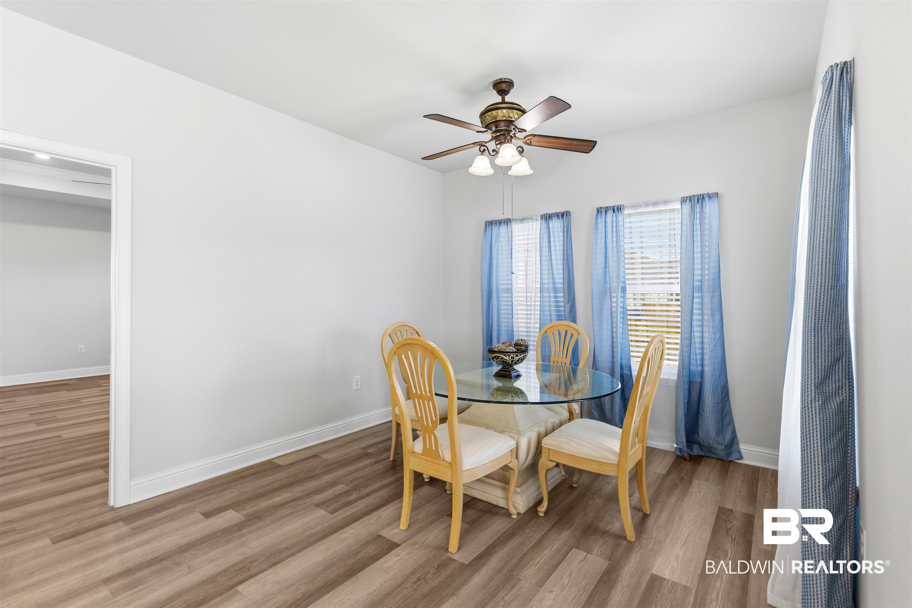485 Shepard Street Gulf Shores, AL 36542 - Photo 18 of 53 Dining room featuring wood finished floors and ceiling fan