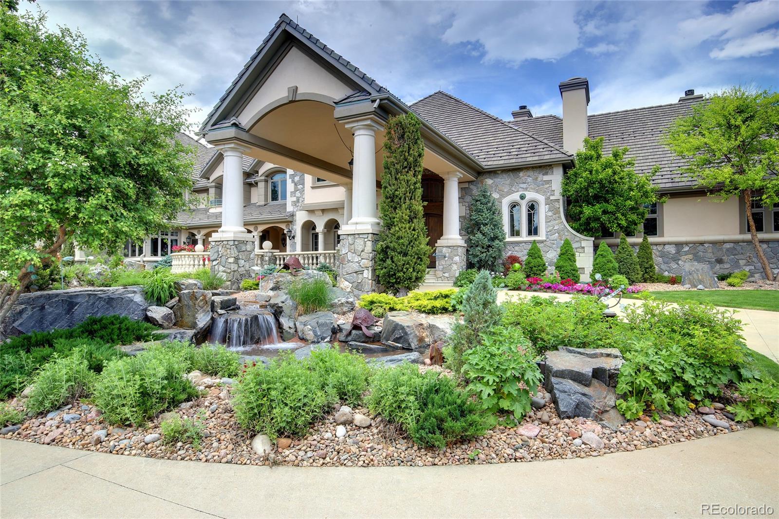1154 South Grapevine Road Golden, CO 80401 - Photo 1 of 31 a front view of a house with garden