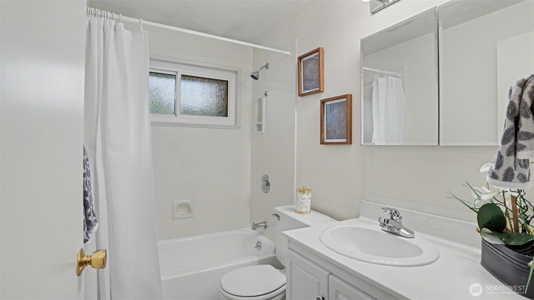 12515 Southeast 171st Street Renton, WA 98058 - Photo 17 of 24 a bathroom with a sink toilet and shower