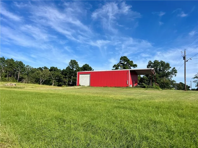 a view of a yard with an outdoor space and porch