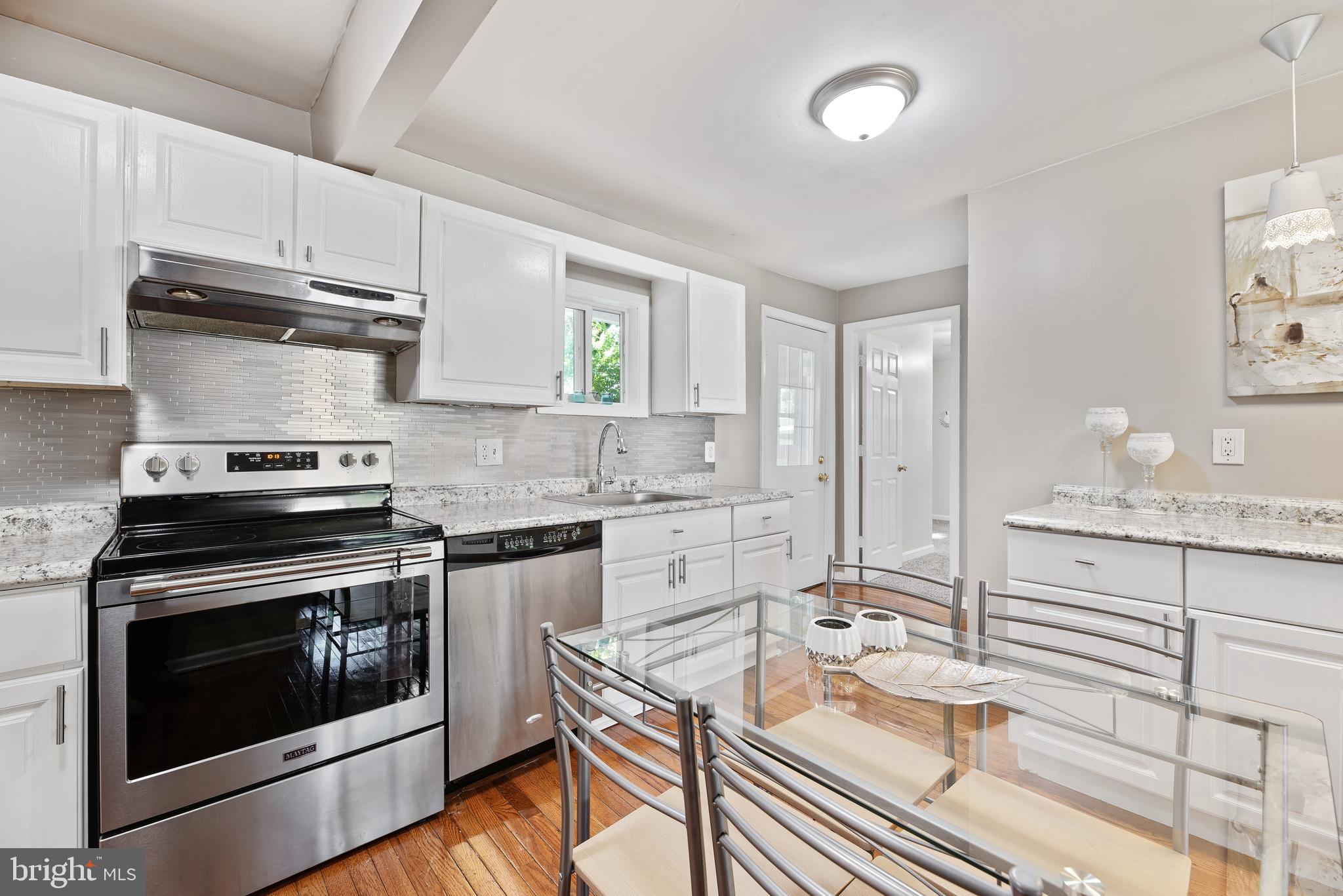719 George Avenue Baltimore, MD 21221 - Photo 8 of 31 Updated with tile backsplash and stainless applian