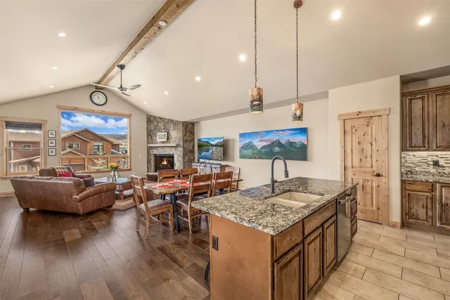 a kitchen that has a table and chairs in it