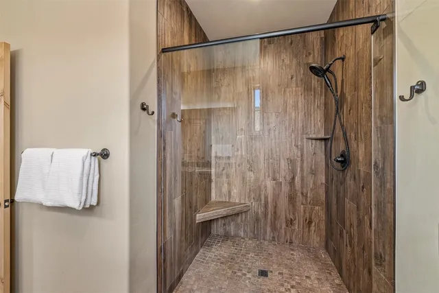 a bathroom with a shower and a sink